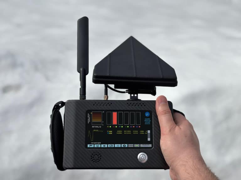 Person using the Hunter a handheld mobile phone detector